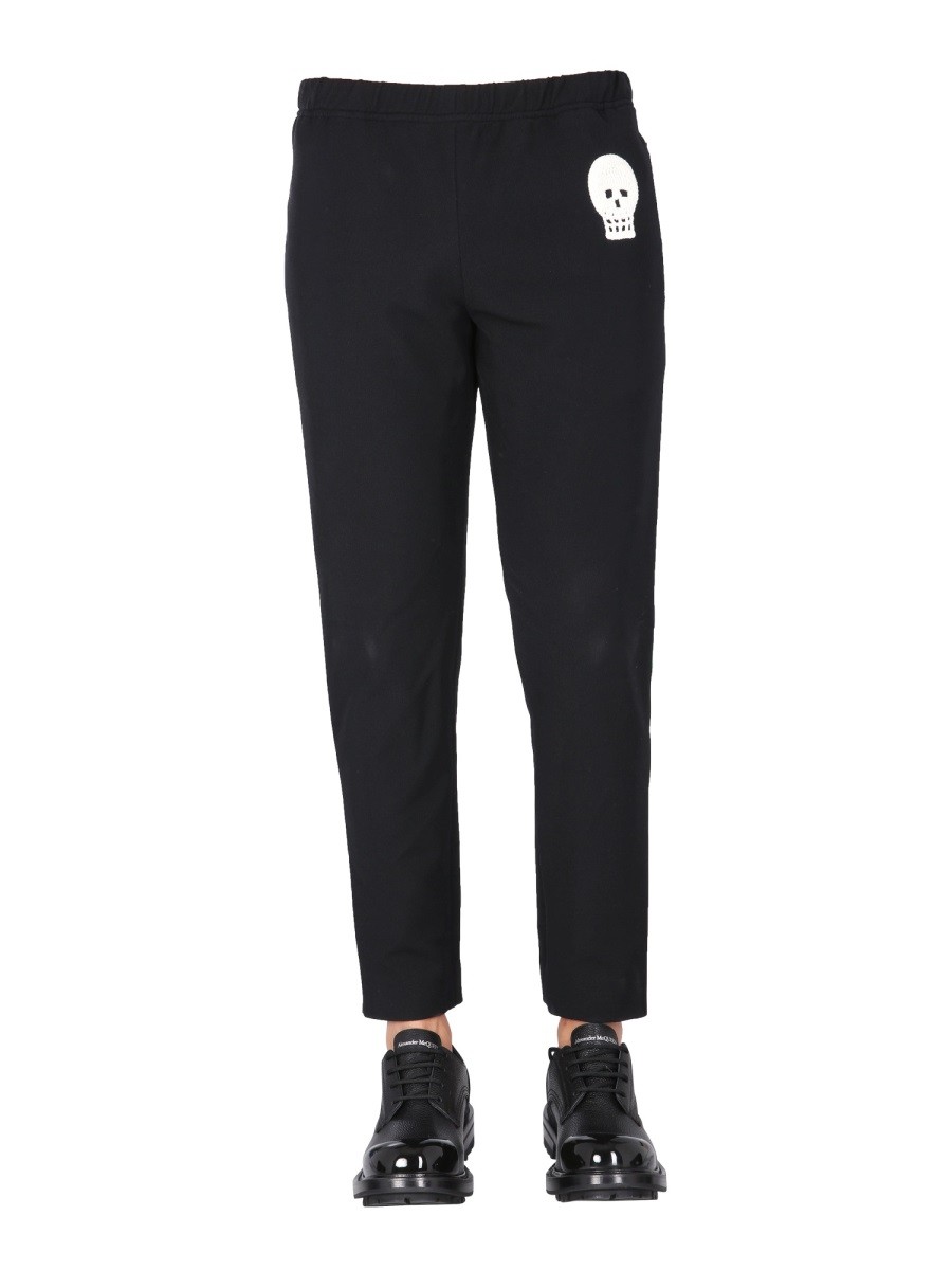 JOGGING PANTS WITH EMBROIDERED SKULL Alexander Mcqueen Man